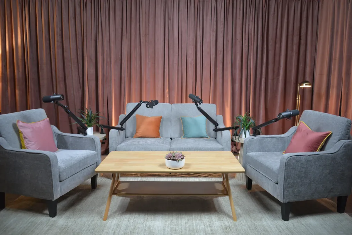 Bushwick podcast studio lounge seating setup with microphones